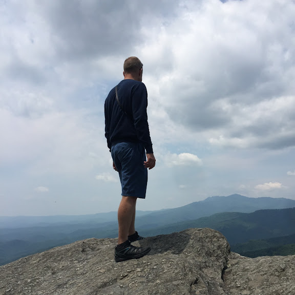 Profile Picture of Adrián Moreno (@zetxek), working side by side with a colleague: sitting on a desk, while looking at a screen